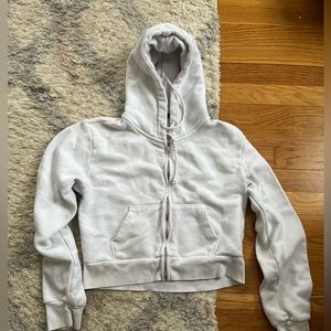 White cropped brandy melville sweatshirt. Zip up
